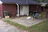 The old patio area when we were just starting, with stakes driven where posts would eventually go.