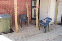 The deck at the back door, with rock 'clamps' over the back porch